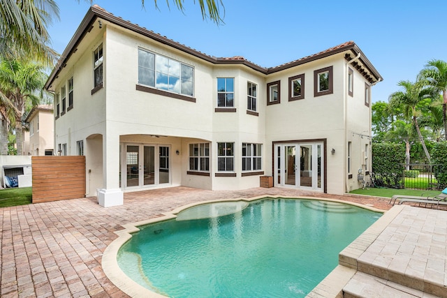 4205 Artesa Dr, Boynton Beach, FL 33436 - rear view of house with french doors, a patio area, stucco siding, and fence