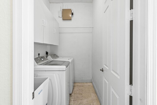 4205 Artesa Dr, Boynton Beach, FL 33436 - clothes washing area with cabinet space, washing machine and clothes dryer, and baseboards