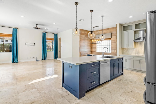 4205 Artesa Dr, Boynton Beach, FL 33436 - kitchen featuring a sink, appliances with stainless steel finishes, wall chimney exhaust hood, tasteful backsplash, and healthy amount of natural light