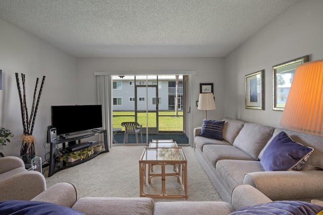 210 SE Village Dr Unit 210, Port Saint Lucie, FL 34952 - living room with carpet floors and a textured ceiling