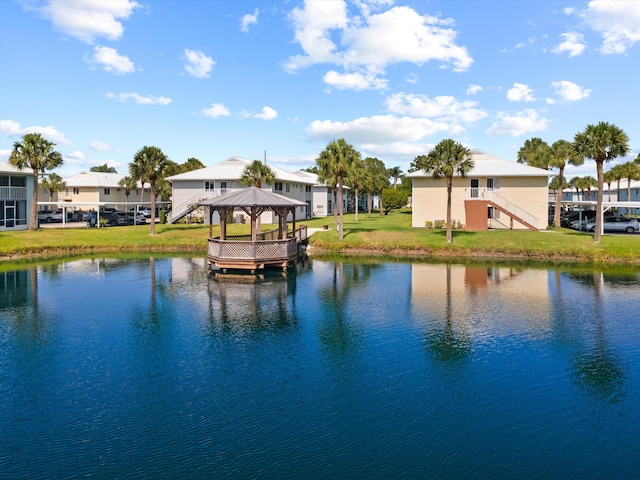 210 SE Village Dr Unit 210, Port Saint Lucie, FL 34952 - water view with a gazebo, stairs, and nearby suburban area