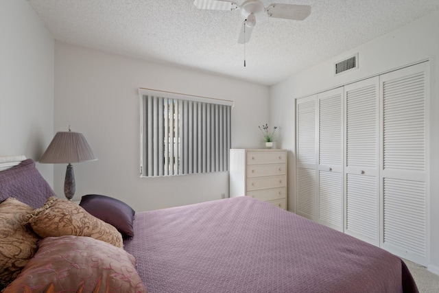 210 SE Village Dr Unit 210, Port Saint Lucie, FL 34952 - bedroom with a closet, a textured ceiling, carpet, and ceiling fan