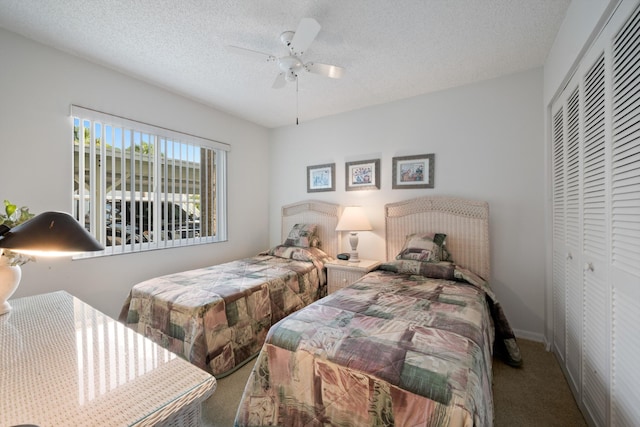 210 SE Village Dr Unit 210, Port Saint Lucie, FL 34952 - carpeted bedroom featuring a closet, a textured ceiling, and ceiling fan