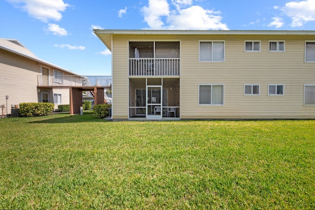 210 SE Village Dr Unit 210, Port Saint Lucie, FL 34952 - back of house with a lawn and central AC unit