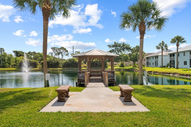 210 SE Village Dr Unit 210, Port Saint Lucie, FL 34952 - dock featuring a gazebo, a water view, and a yard