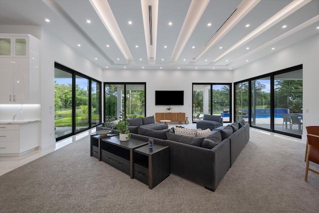 18074 Sentinel Cir, Boca Raton, FL 33496 - living room with light colored carpet, recessed lighting, and a towering ceiling
