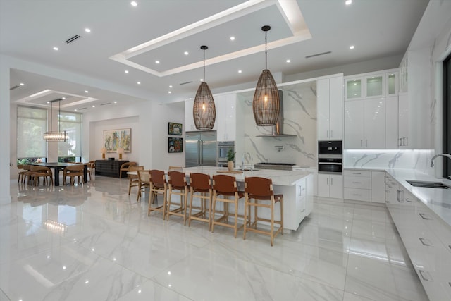 18074 Sentinel Cir, Boca Raton, FL 33496 - kitchen with appliances with stainless steel finishes, a raised ceiling, a sink, modern cabinets, and recessed lighting