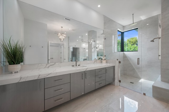 18074 Sentinel Cir, Boca Raton, FL 33496 - bathroom featuring a shower stall, a chandelier, vanity, and marble tiled flooring