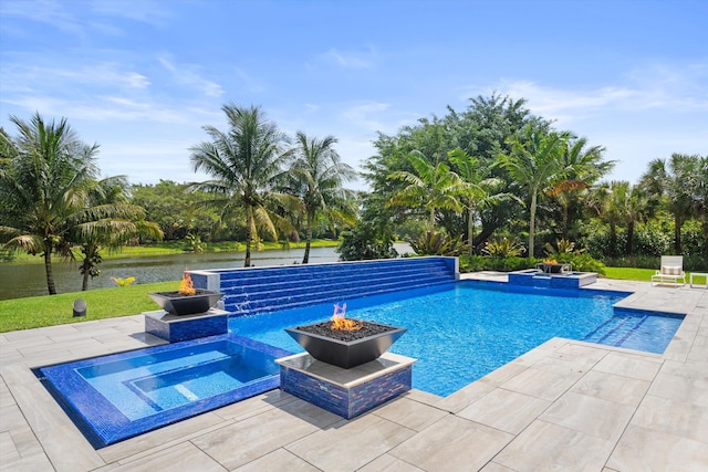 18074 Sentinel Cir, Boca Raton, FL 33496 - view of pool with an outdoor fire pit, a pool with connected hot tub, a patio area, and a water view