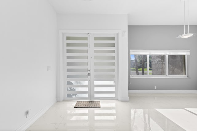 5320 SW 199th Ave, Pembroke Pines, FL 33332 - foyer entrance featuring marble look tile flooring and baseboards