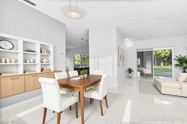 5320 SW 199th Ave, Pembroke Pines, FL 33332 - dining space featuring baseboards and light marble finish flooring
