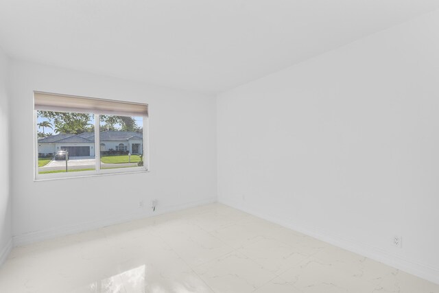 5320 SW 199th Ave, Pembroke Pines, FL 33332 - unfurnished room featuring marble look tiles and baseboards