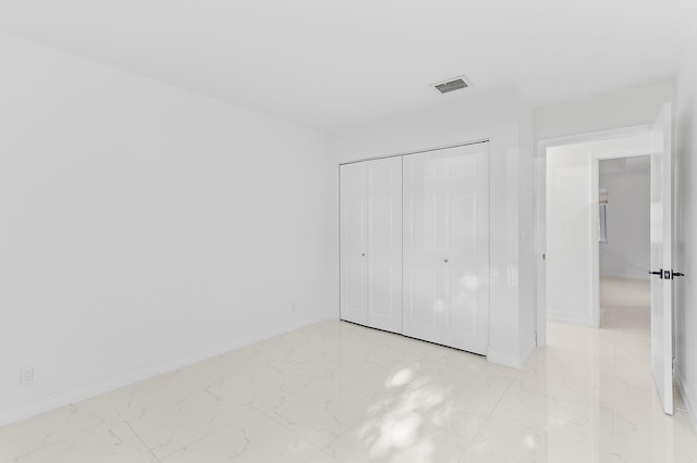 5320 SW 199th Ave, Pembroke Pines, FL 33332 - unfurnished bedroom featuring light marble finish flooring, baseboards, and a closet