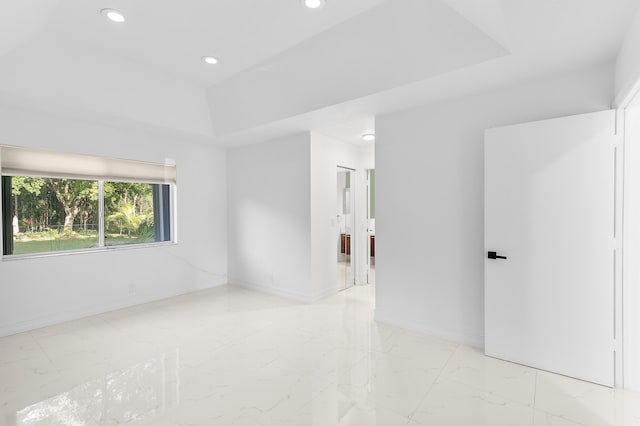 5320 SW 199th Ave, Pembroke Pines, FL 33332 - unfurnished room featuring a raised ceiling, light marble finish floors, recessed lighting, and baseboards