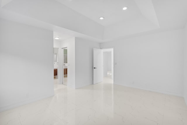 5320 SW 199th Ave, Pembroke Pines, FL 33332 - empty room with light marble finish flooring, recessed lighting, baseboards, and a tray ceiling