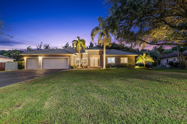 5320 SW 199th Ave, Pembroke Pines, FL 33332 - single story home with asphalt driveway, a tile roof, an attached garage, stucco siding, and french doors