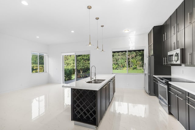 5320 SW 199th Ave, Pembroke Pines, FL 33332 - kitchen with appliances with stainless steel finishes, a sink, recessed lighting, a center island with sink, and light countertops