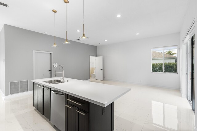 5320 SW 199th Ave, Pembroke Pines, FL 33332 - kitchen featuring a sink, dark cabinetry, open floor plan, light countertops, and an island with sink