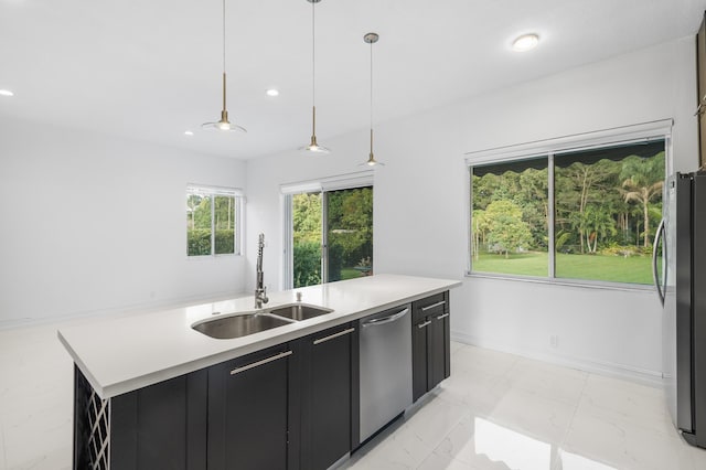 5320 SW 199th Ave, Pembroke Pines, FL 33332 - kitchen featuring stainless steel appliances, a sink, dark cabinets, a kitchen island with sink, and light countertops