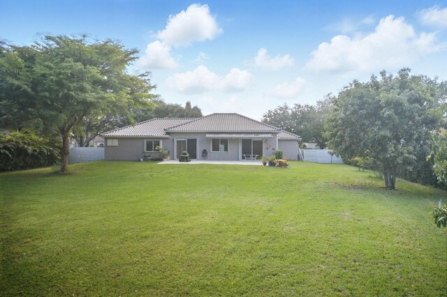 5320 SW 199th Ave, Pembroke Pines, FL 33332 - back of property with a tiled roof, a patio, and stucco siding