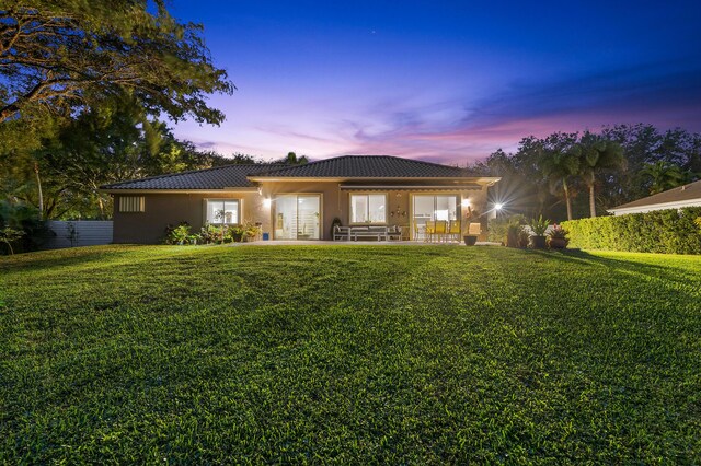 5320 SW 199th Ave, Pembroke Pines, FL 33332 - rear view of property with a tile roof and stucco siding