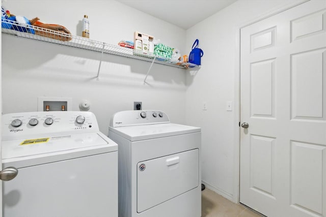 482 NW Fairfax Ave, Port Saint Lucie, FL 34983 - washroom featuring independent washer and dryer and light tile patterned flooring