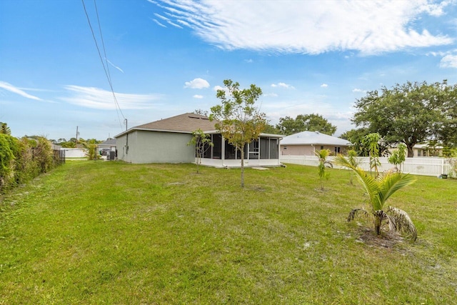 482 NW Fairfax Ave, Port Saint Lucie, FL 34983 - back of property featuring a sunroom