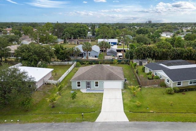 482 NW Fairfax Ave, Port Saint Lucie, FL 34983 - aerial view of residential area with a tree filled landscape