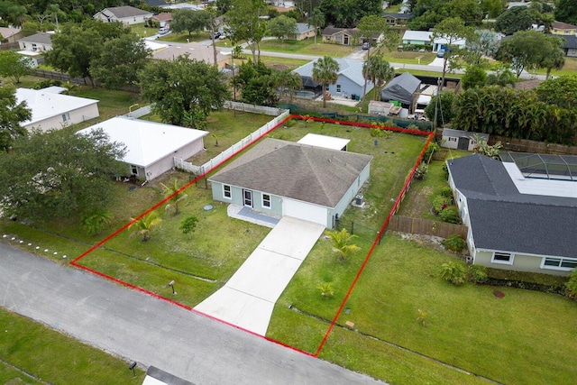 482 NW Fairfax Ave, Port Saint Lucie, FL 34983 - aerial perspective of suburban area featuring property parcel outlined