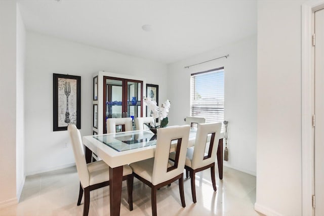 482 NW Fairfax Ave, Port Saint Lucie, FL 34983 - dining room with french doors and baseboards
