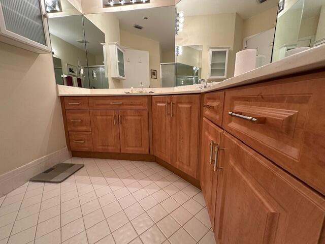 5155 Europa Dr Unit R, Boynton Beach, FL 33437 - full bath featuring tile patterned floors, a shower stall, vanity, and baseboards
