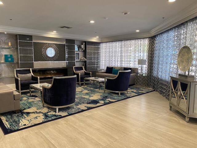 5155 Europa Dr Unit R, Boynton Beach, FL 33437 - community lobby featuring crown molding and recessed lighting