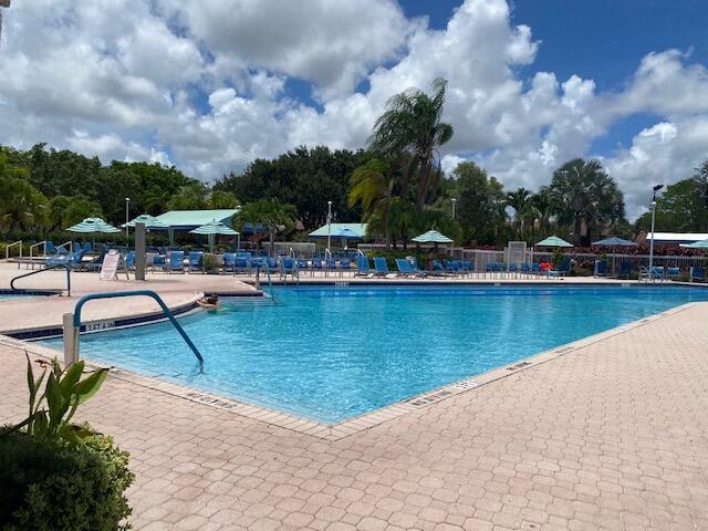 5155 Europa Dr Unit R, Boynton Beach, FL 33437 - community pool with a patio area and fence
