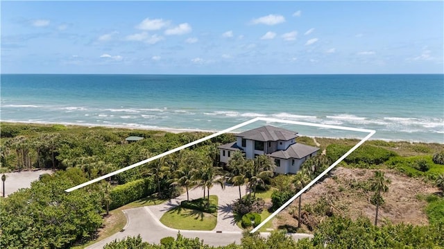 view of subject property featuring unending shoreline