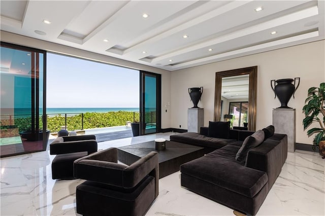 living room with light marble finish floors, baseboards, a water view, and recessed lighting
