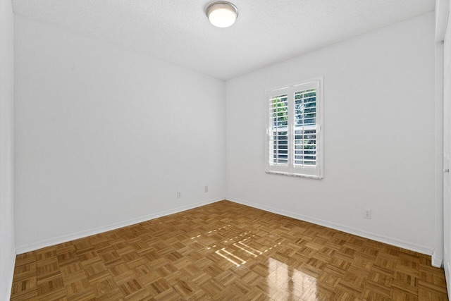 22 Pepperwood Ct, Boynton Beach, FL 33426 - spare room with baseboards and a textured ceiling