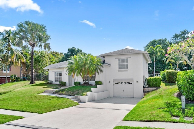 22 Pepperwood Ct, Boynton Beach, FL 33426 - view of front facade with stucco siding, a garage, and driveway