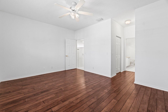 22 Pepperwood Ct, Boynton Beach, FL 33426 - unfurnished bedroom featuring dark wood-style floors, ensuite bathroom, baseboards, and ceiling fan