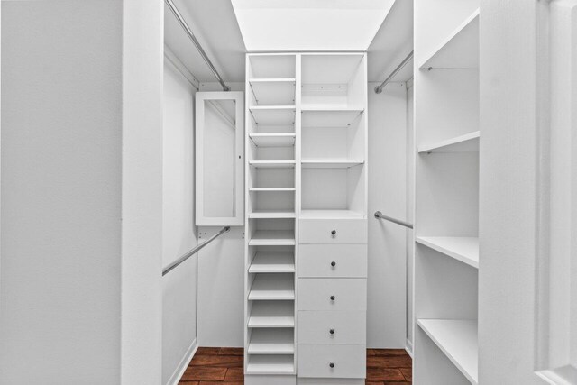 22 Pepperwood Ct, Boynton Beach, FL 33426 - spacious closet with dark wood-style flooring