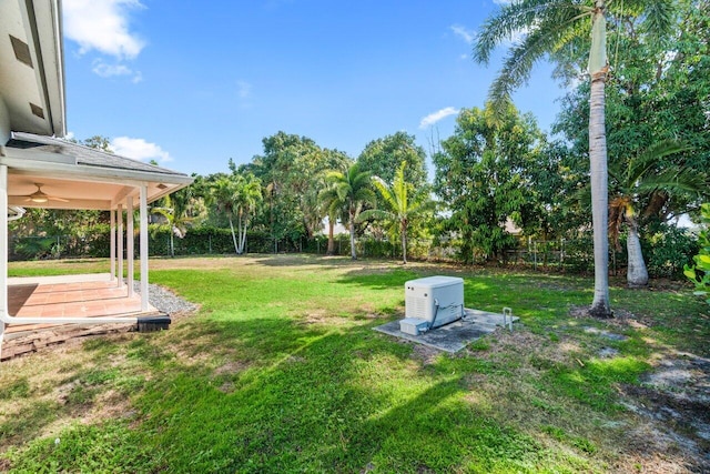 22 Pepperwood Ct, Boynton Beach, FL 33426 - view of yard featuring a ceiling fan and view of scattered trees