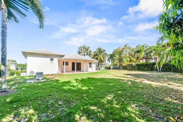 22 Pepperwood Ct, Boynton Beach, FL 33426 - view of yard featuring central AC and a patio area