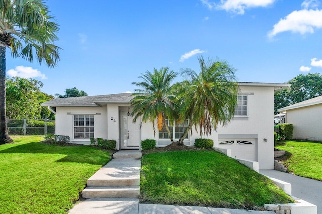 22 Pepperwood Ct, Boynton Beach, FL 33426 - view of front facade with stucco siding and a garage