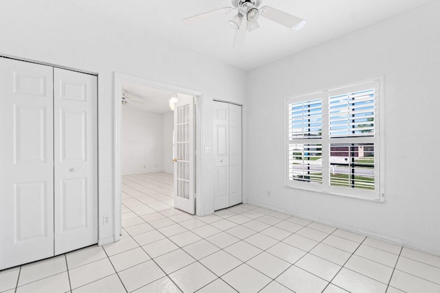 22 Pepperwood Ct, Boynton Beach, FL 33426 - unfurnished bedroom featuring light tile patterned flooring and ceiling fan