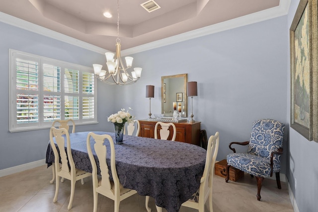 7668 SE Laque Cir, Stuart, FL 34997 - dining area with a chandelier, a raised ceiling, light tile patterned flooring, baseboards, and crown molding