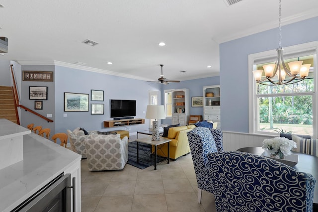7668 SE Laque Cir, Stuart, FL 34997 - living room with ornamental molding, a chandelier, wine cooler, stairs, and light tile patterned floors