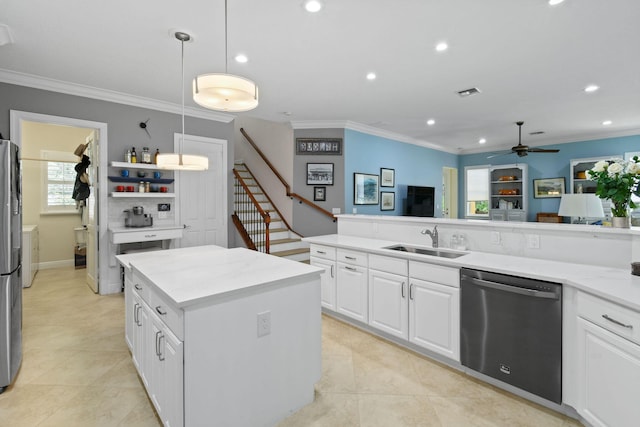 7668 SE Laque Cir, Stuart, FL 34997 - kitchen featuring appliances with stainless steel finishes, a sink, crown molding, recessed lighting, and a ceiling fan