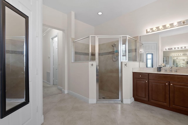 7668 SE Laque Cir, Stuart, FL 34997 - bathroom with a stall shower, vanity, baseboards, and tile patterned flooring