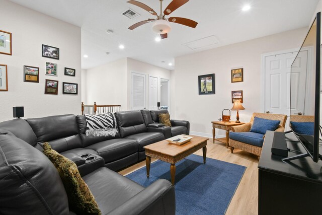 7668 SE Laque Cir, Stuart, FL 34997 - living room featuring a ceiling fan, light wood-type flooring, recessed lighting, attic access, and baseboards