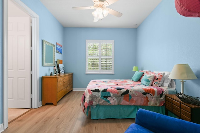 7668 SE Laque Cir, Stuart, FL 34997 - bedroom featuring light wood-style flooring, baseboards, and ceiling fan