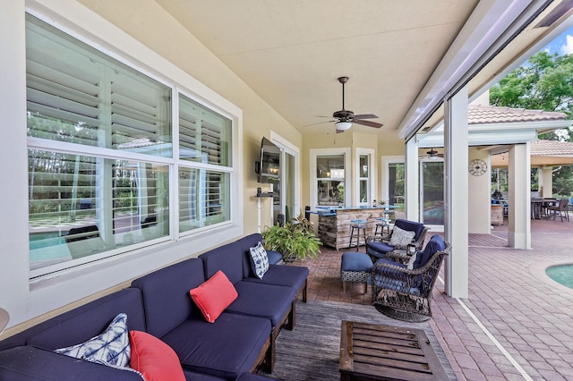 7668 SE Laque Cir, Stuart, FL 34997 - view of patio featuring an outdoor hangout area, a ceiling fan, and outdoor dining space